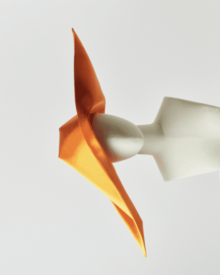 Image of a striking orange cornette on a mannequin