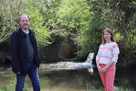 Councillors visit River Coln in Fairford: Pictured: Cllr Andrew Doherty (Cabinet Member for Environment) and Cllr Lisa Spivey (Cabinet Member for Housing) at the River Coln in Fairford