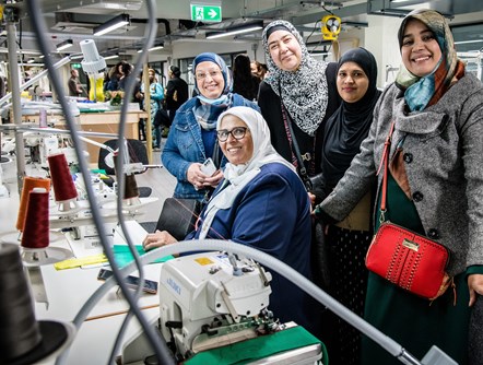 Designer-maker Majida Sayam, second left, in the new FC Designer Workspace with members of the Jannaty sewing group.