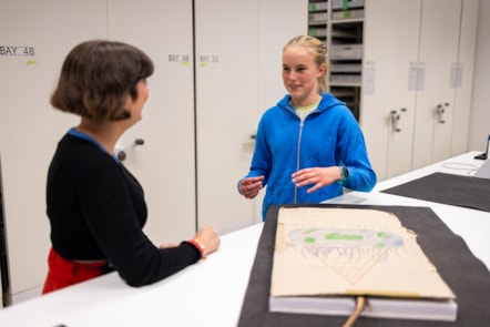 Bridget tells Curator Mhairi Maxwell abour her climate protest placard at the National Museums Colletion Centre. Photo (c) Duncan McGlynn (1)