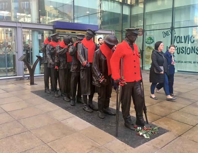 Wrap Up Manchester dress the blind veterans' statue outside Manchester Piccadilly station