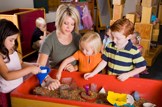 Extra nursery care will benefit 100,000 families: Education-nursery-school-teacher-pupils-play