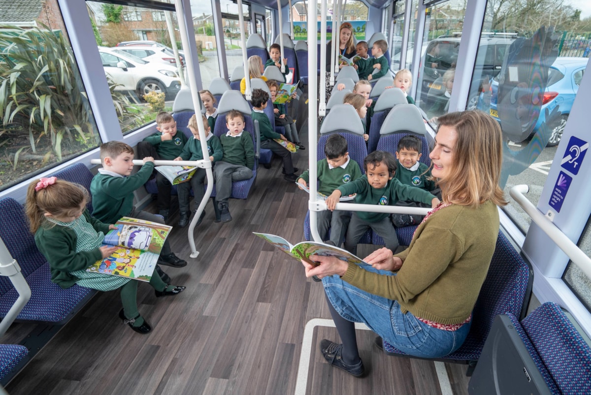 Cllr Ravilious reading on the bus 2