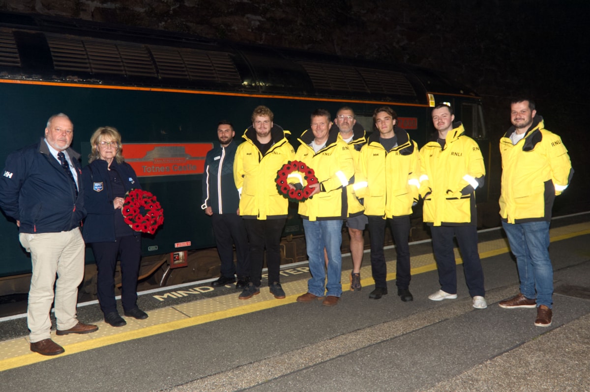 RNLI representatives Dave Nicoll and Gaynor Williams, left, with  Sleeper Lounge Host, Joe Lorusso, and members of the Penlee Lifeboat crew
Picture credit: Phil Monckton