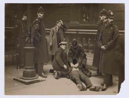 40 Hours’ Strike in George Square, Glasgow, 1919. David Kirkwood (before he became MP) on the ground after being batoned by police, while Willie Gallacher stands by after being arrested
