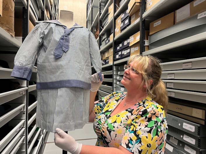 Sailor suits: Gemma Brown, site development officer at the Leeds Discovery Centre, with one of the eye-catching sailor suit style outfits in the Leeds collection.
The eye-catching naval attire includes a classic range of blue and white outfits, dresses and bellbottom trousers, looks which became hugely popular for children during the late 19th and early 20th centuries.
The suits are among an array of historic fashions which will be explored in an upcoming workshop at Leeds Discovery Centre looking back on centuries of fabulous clothes and costumes.