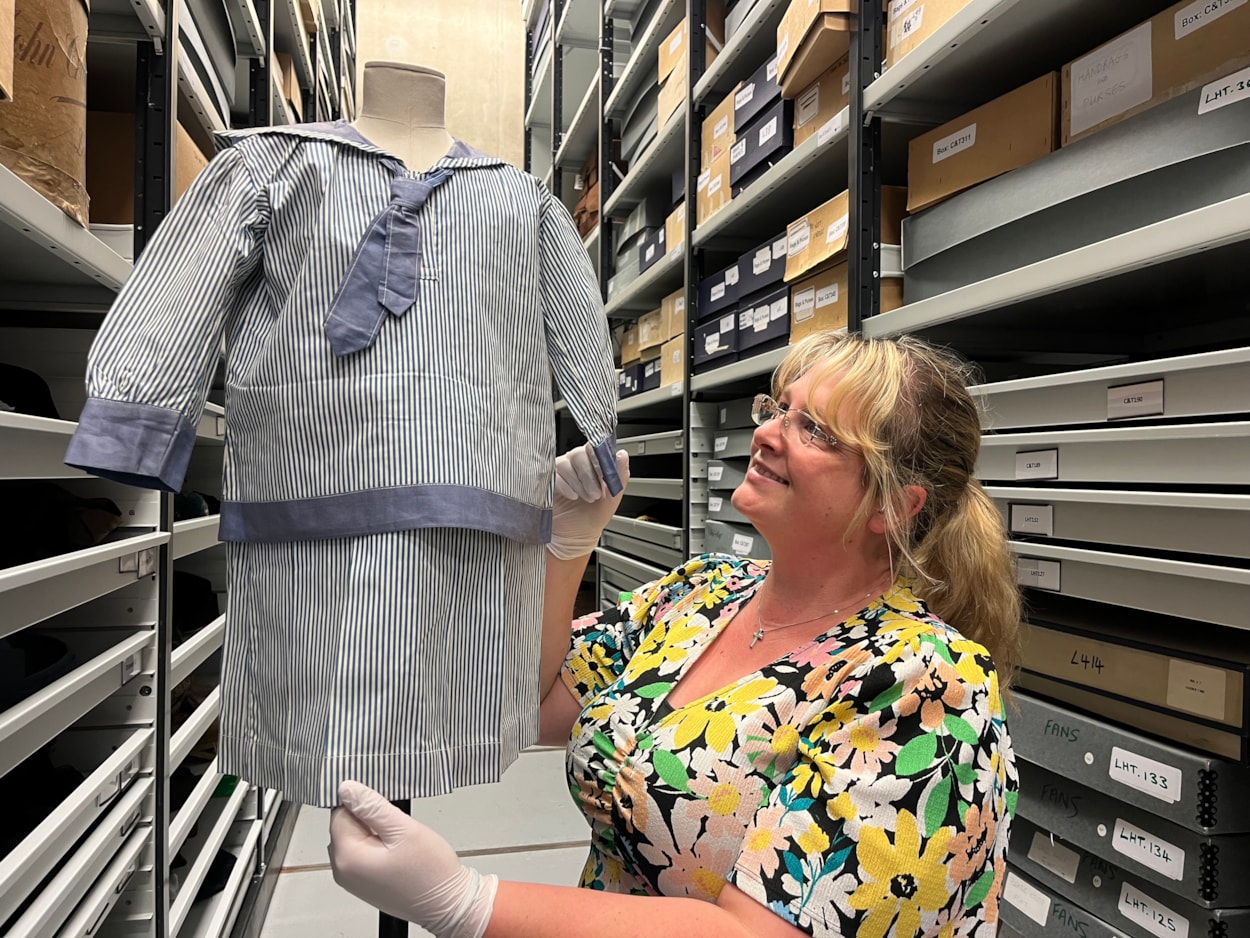 Sailor suits: Gemma Brown, site development officer at the Leeds Discovery Centre, with one of the eye-catching sailor suit style outfits in the Leeds collection.
The eye-catching naval attire includes a classic range of blue and white outfits, dresses and bellbottom trousers, looks which became hugely popular for children during the late 19th and early 20th centuries.
The suits are among an array of historic fashions which will be explored in an upcoming workshop at Leeds Discovery Centre looking back on centuries of fabulous clothes and costumes.