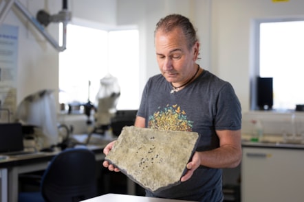 Dr Stig Walsh with a cast of the Breugnathair elgolensis fossil. Image © Duncan McGlynn  (6)