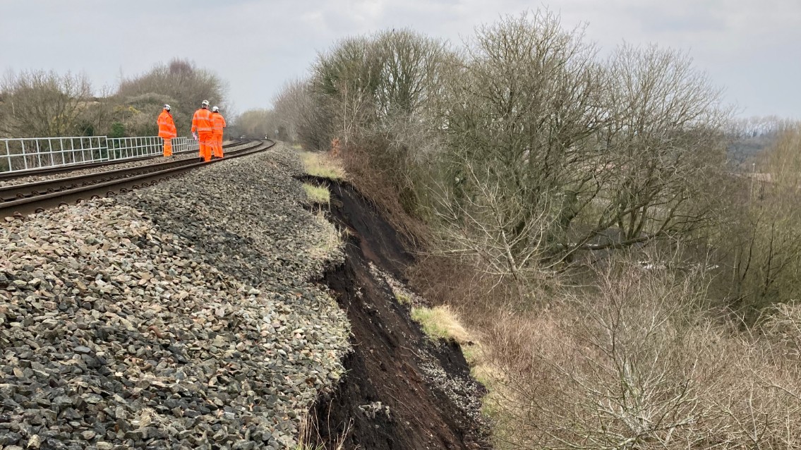 Rail passengers urged to check before travelling after landslip closes line between Wolverhampton and Shrewsbury: Network Rail engineers inspect the landslip near Oakengates