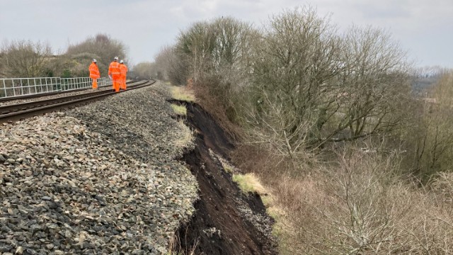 Network Rail engineers inspect the landslip near Oakengates: Network Rail engineers inspect the landslip near Oakengates