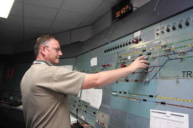 Nottingham resignalling: Trent Power Signal Box is switched out: Nottingham resignalling: Local operations manager Glyn Williams helps to signal the last train from Trent PSB - 1969-2013.