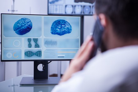 doctor-using-smartphone-help-patient-sitting-his-office-doctor-talking-phone