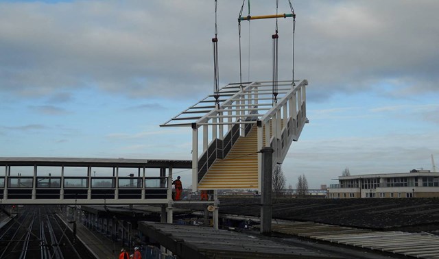 Ipswich footbridge lifted in (2): One of the staircases which form part of the new, fully accessible footbridge at Ipswich station is lifted into place (14 Nov 2010).