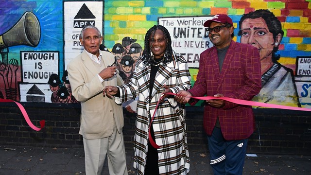 Ribbon cutting by Raghib Ahsan, Dr Janet Bailey and painter Haider Ali at Grunwick dispute mural unveiling Credit Network Rail/Jas Sansi 16x9: Ribbon cutting by Raghib Ahsan, Dr Janet Bailey and painter Haider Ali at Grunwick dispute mural unveiling Credit Network Rail/Jas Sansi 16x9