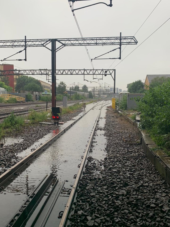 Flash flooding on West Coast main line in Camden July 12