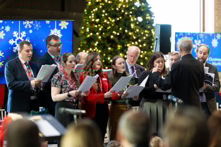 Colleagues from across the rail industry singing together in a choir, LNER