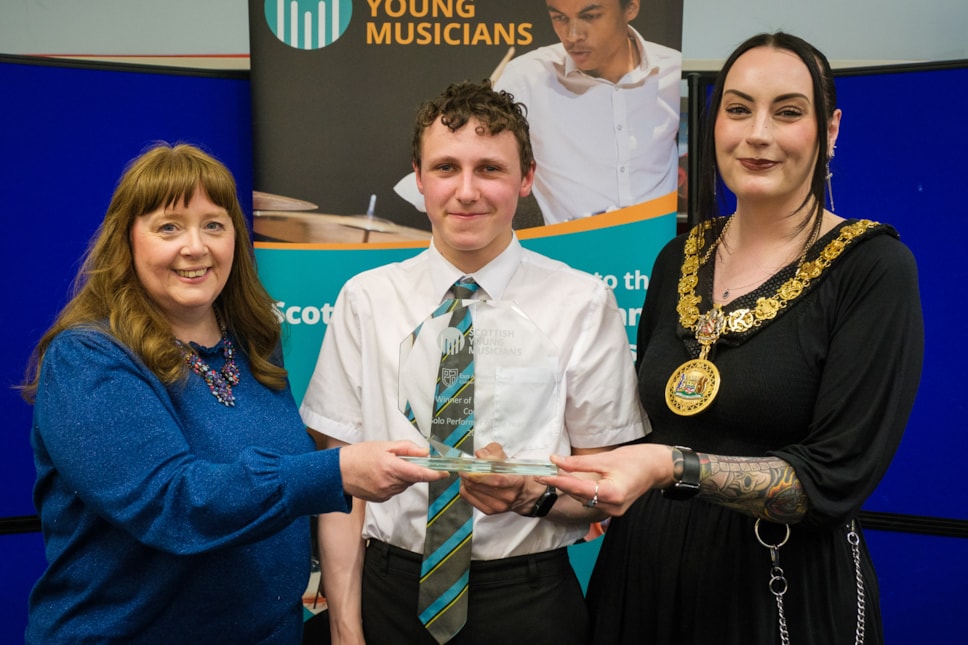 Provost Leitch and Councillor Cowan present Gregor with this award