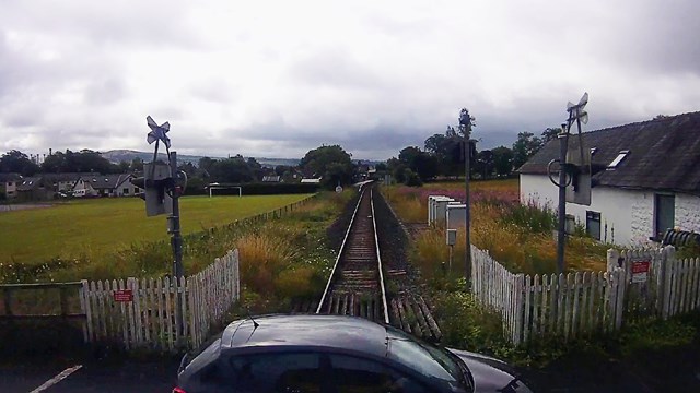 Shocking CCTV films car inches away from striking train on level crossing: Burneside level crossing CCTV near miss still (1)