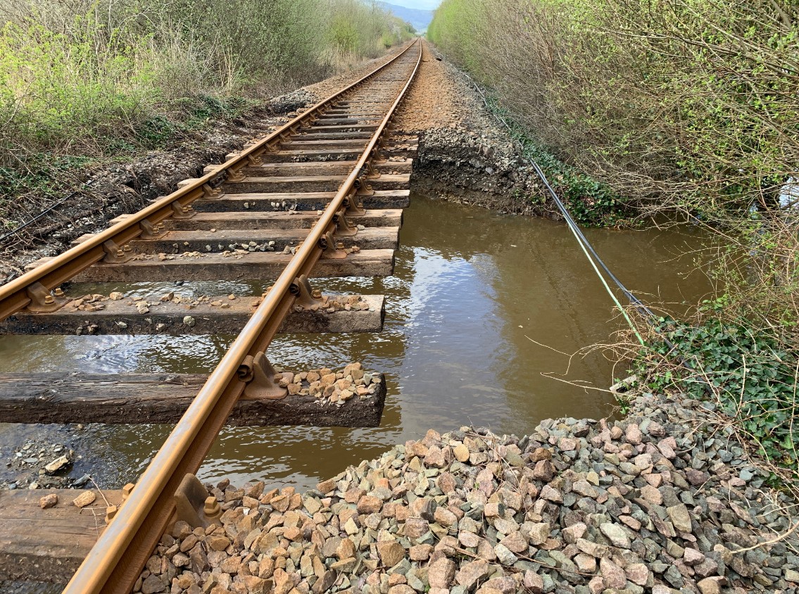 Picture from near Dolgarrog station on the Conwy Valley Line after river flooding washed away ballast on 9 April 2024-4