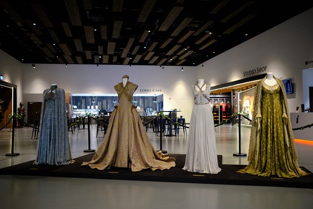 Wedding costume display at Game of Thrones Studio Tour: (left to right) 
The velvet gown worn by Lysa Arryn in Season 4 for her marriage to Peter Baelish, shows remarkable detail representing House Tully and House Arryn; the stunning gold wedding dress worn by Sansa Stark (Season 3) for her marriage to Tyrion Lannister at the Great Sept of Baelor; Lyanna Stark’s tulle skirt and bodice with a metal filigree collar that she wore for her secret wedding to Rhaegar Targaryen, and Roslin Frey’s iconic green and gold brocade coat and intricate cream crochet veil from her wedding to Edmure Tully.

Credit: Game of Thrones Studio Tour