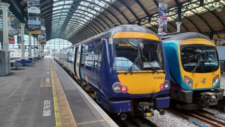 Image shows a Northern train and TransPennine Express train at Hull station