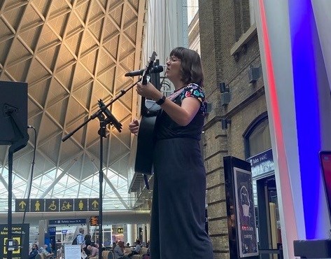 Lucy May Walker performing at King's Cross