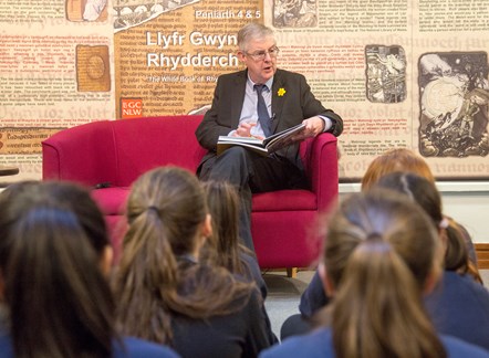 First Minister reads extracts of the Mabinogion to school pupils in the national Library of Wales ahead of World Book Day