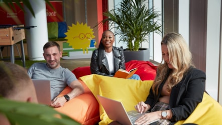 Colleagues sat on beanbags cropped