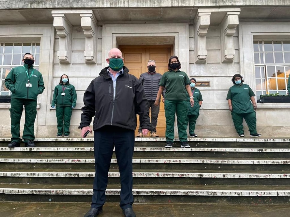 Hackney Council Director of Sustainability and Environmental Services John Wheatley, with cleaning staff in new uniforms