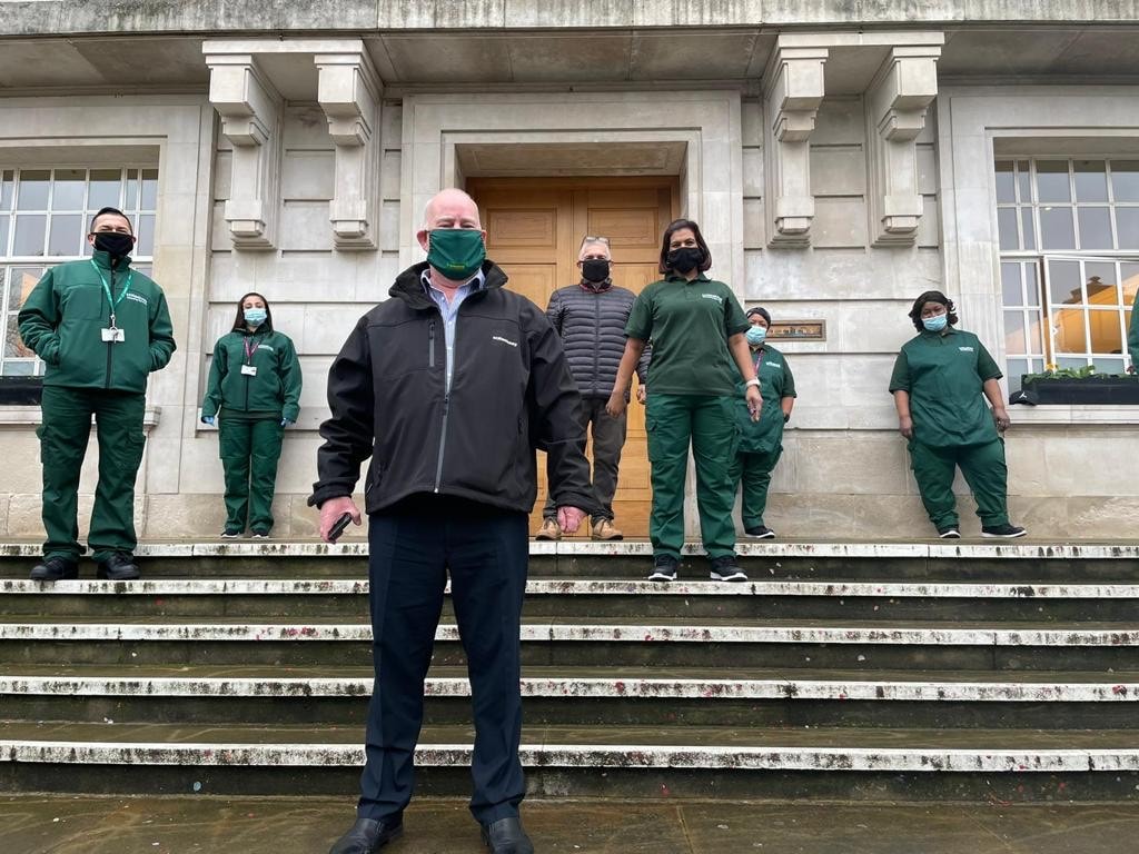 Hackney Council Director of Sustainability and Environmental Services John Wheatley, with cleaning staff in new uniforms