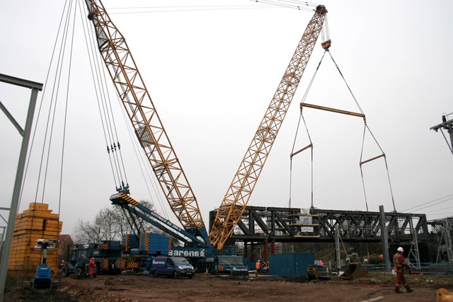 Rugby Birdcage Bridge Removal: A 1200 tonne crane prepares to lift out a 350 tonne section of the redundant 'birdcage' bridge which spanned the West Coast Main Line at Rugby.