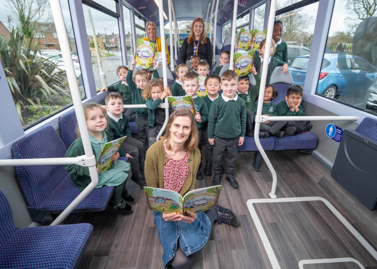 Cllr Ravilious reading on the bus 3