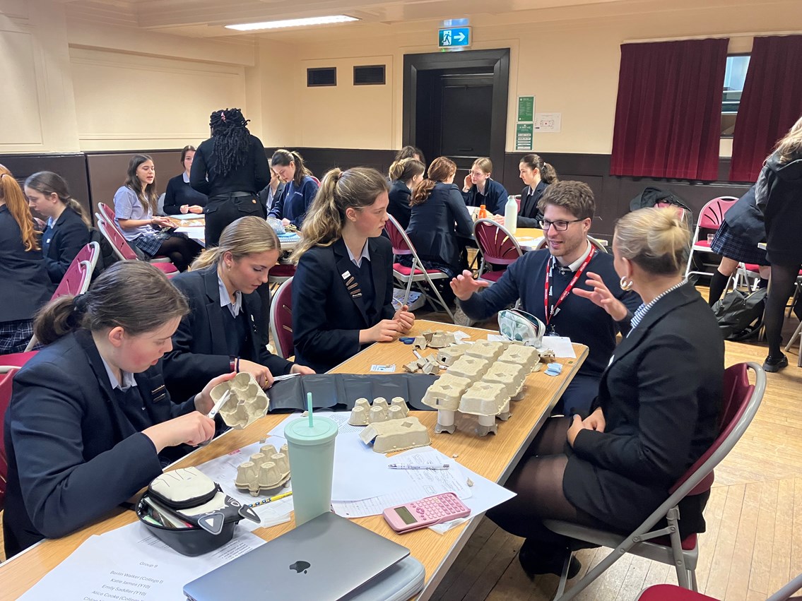 Students at The Mount School constructing their bridge design at a Network Rail STEM day for IWD 3