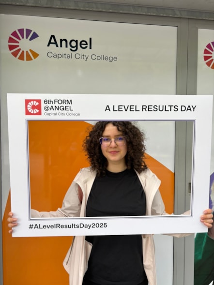 Capital City College Group student Andreea celebrates her results outside the Angel campus