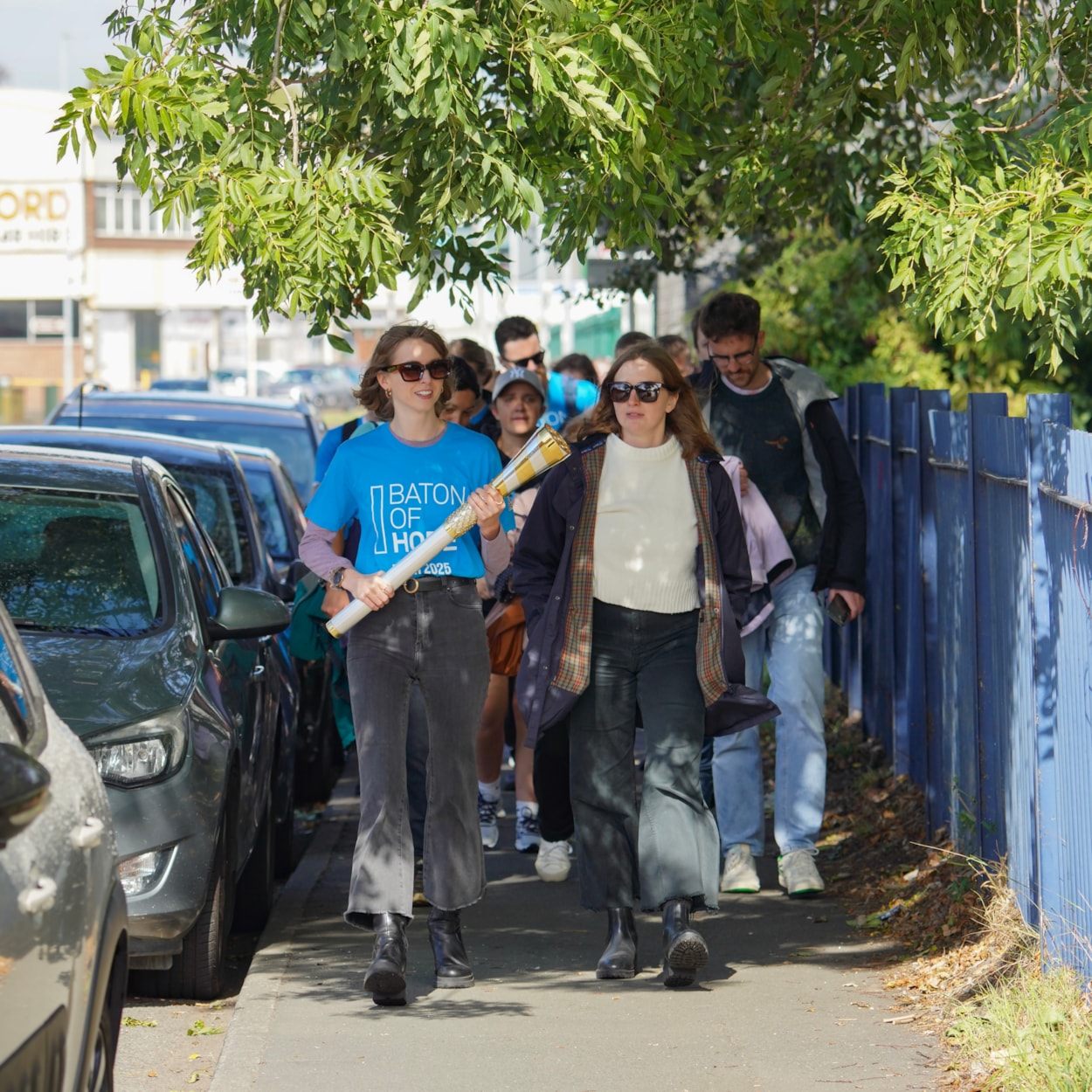 Baton of Hope - Leeds tour 5: Baton bearer Hannah Megaw carries the baton in Holbeck as the Baton of Hope tour comes to Leeds on World Suicide Prevention Day.