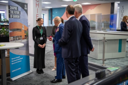 King Charles III speaks to University of Cumbria student Scarlett Southcott at a public engagement in The Bridge centre in Barrow