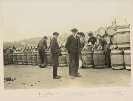 Unknown photographer
Packing Herrings at Aberdeen,  Ca. 1920
Gelatin silver print
Collection: National Library of Scotland, MacKinnon Collection, acquired jointly with the National Galleries of Scotland with assistance from the National Lottery Heritage Fund, the Scottish Government and Art Fund