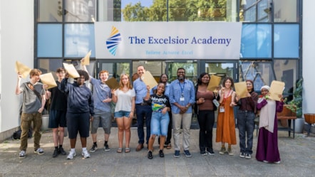 Young people, teachers and Council representatives celebrating their results at The Excelsior Academy in Hackney