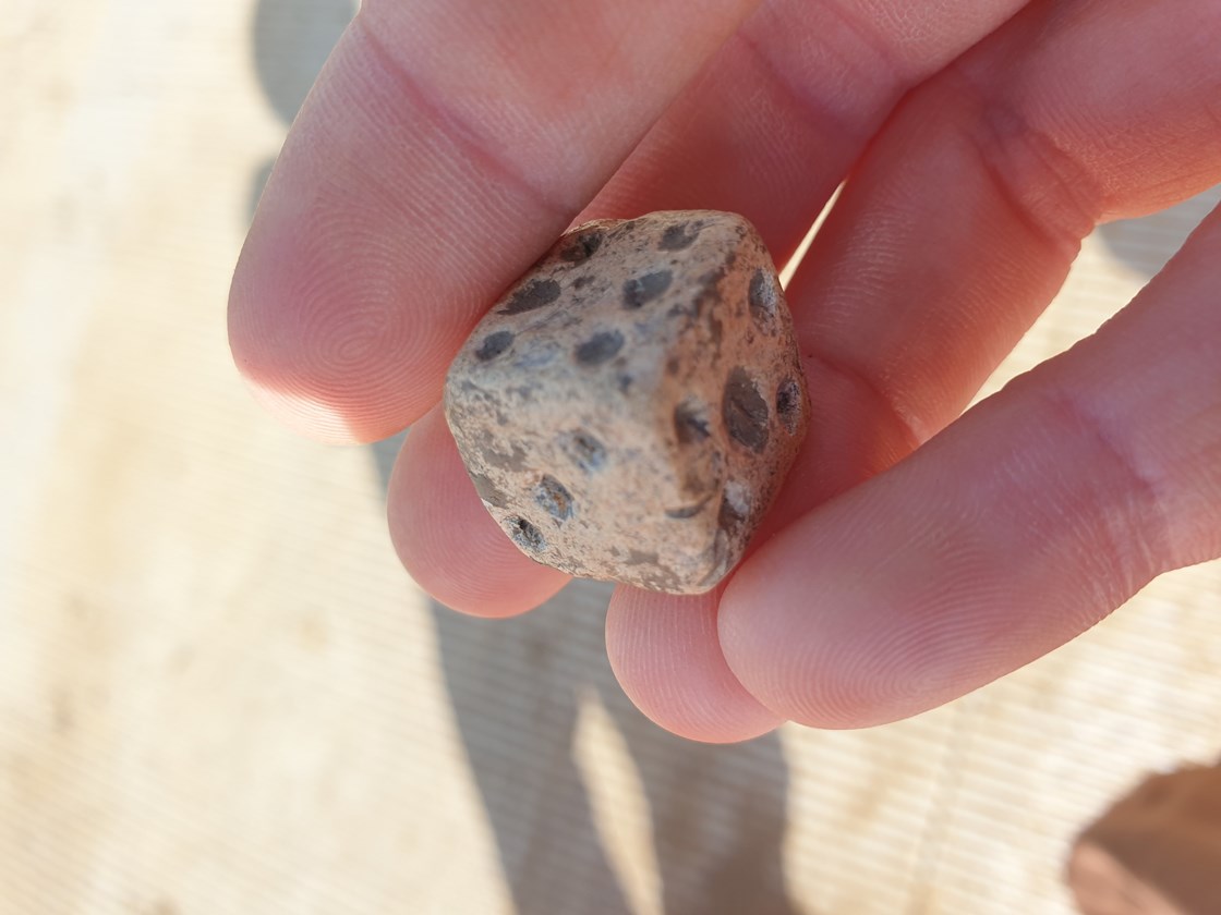 Roman lead die uncovered during archaeological excavations at Fleet Marston, near Aylesbury, Buckinghamshire.: Roman lead die uncovered during archaeological excavations at Fleet Marston, near Aylesbury, Buckinghamshire. Excavations took place during 2021.

Tags: Archaeology, Heritage, Roman artefacts, History, Excavations