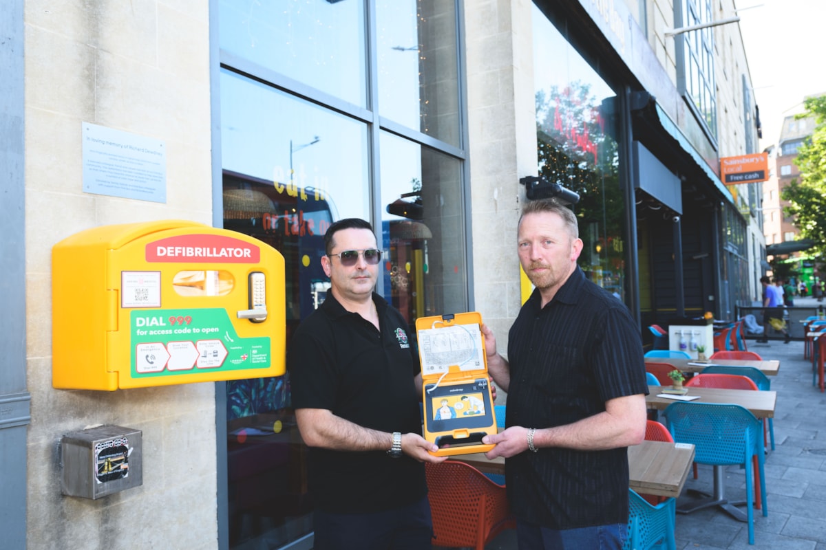 First Bus driver Carlos Santos (left) and Richard Dewdney with the defibrillator @JonCraig Photos