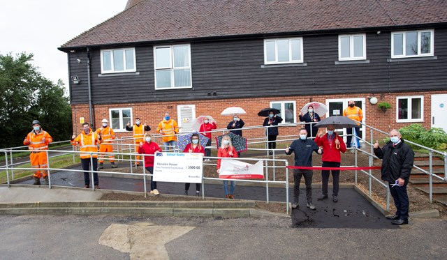 Demelza 1: Network Rail, Balfour Beatty and Seva Rail people celebrate with Demelza Hospice Care for Children ater the completion of the new disabled ramp there.