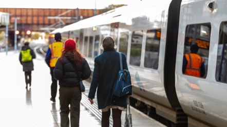 Image shows two customers boarding a Northern train