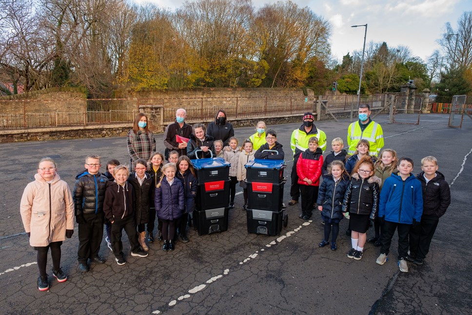 P3/4, with Alyssa and Daniel from P7, receive their new bins