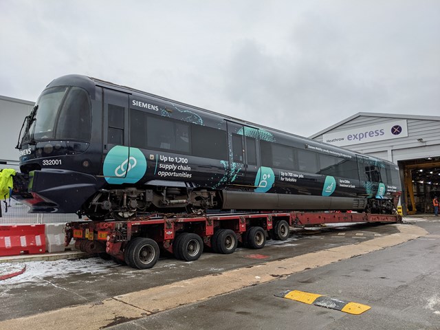 Heathrow Express train leaving depot for last time on low loader