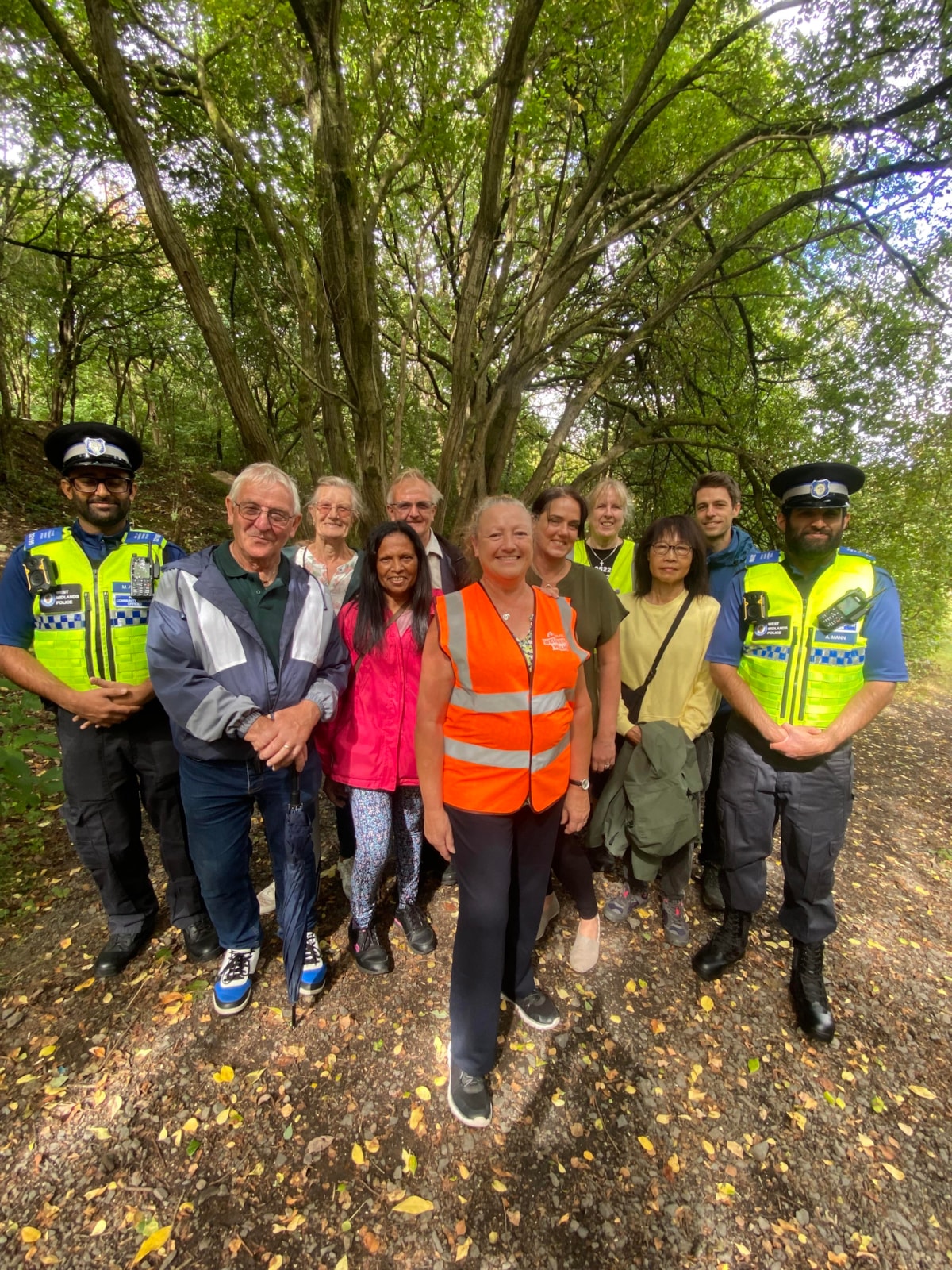 Walk leader Debbie Parkes (orange high-vis) with Councillor Andrea Goddard (Left of Debbie) and local community walkers PT