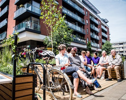 Residents and visitors try out Islington's first parklet - in a car parking bay in Central Street, EC1.  The parklet was officially opened on June 1