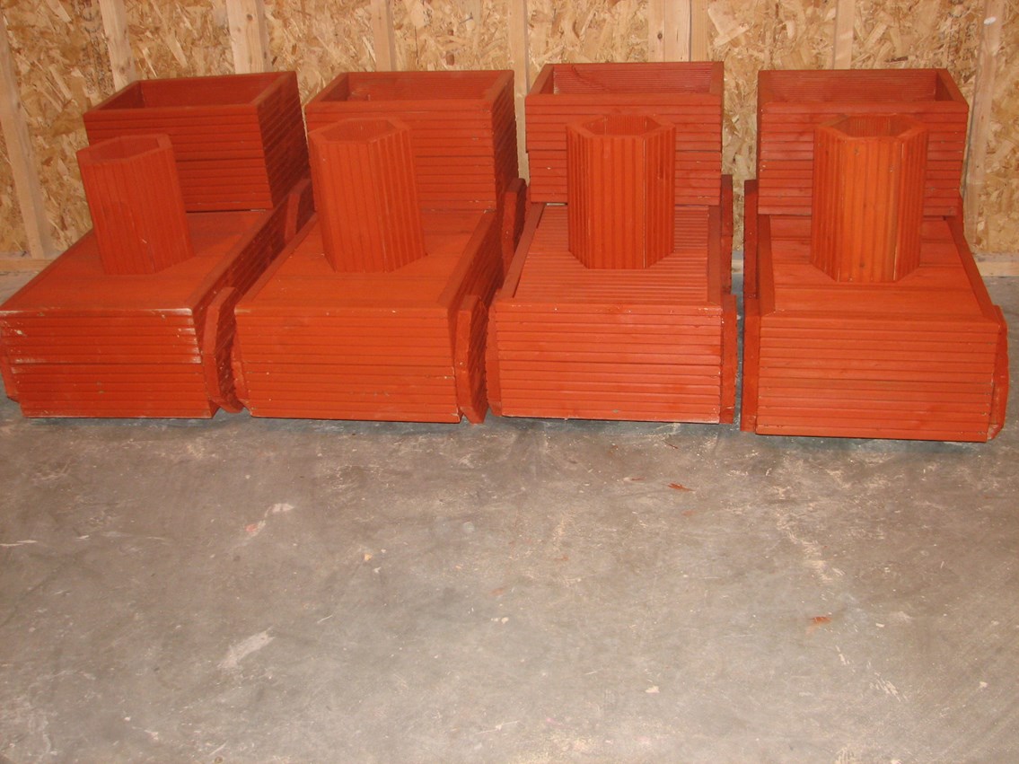Blackrod station planters: Completed planters painted with a terracotta colour wood preservative at the POWERWAVE Skills Centre in Rivington. (Nov 2012)