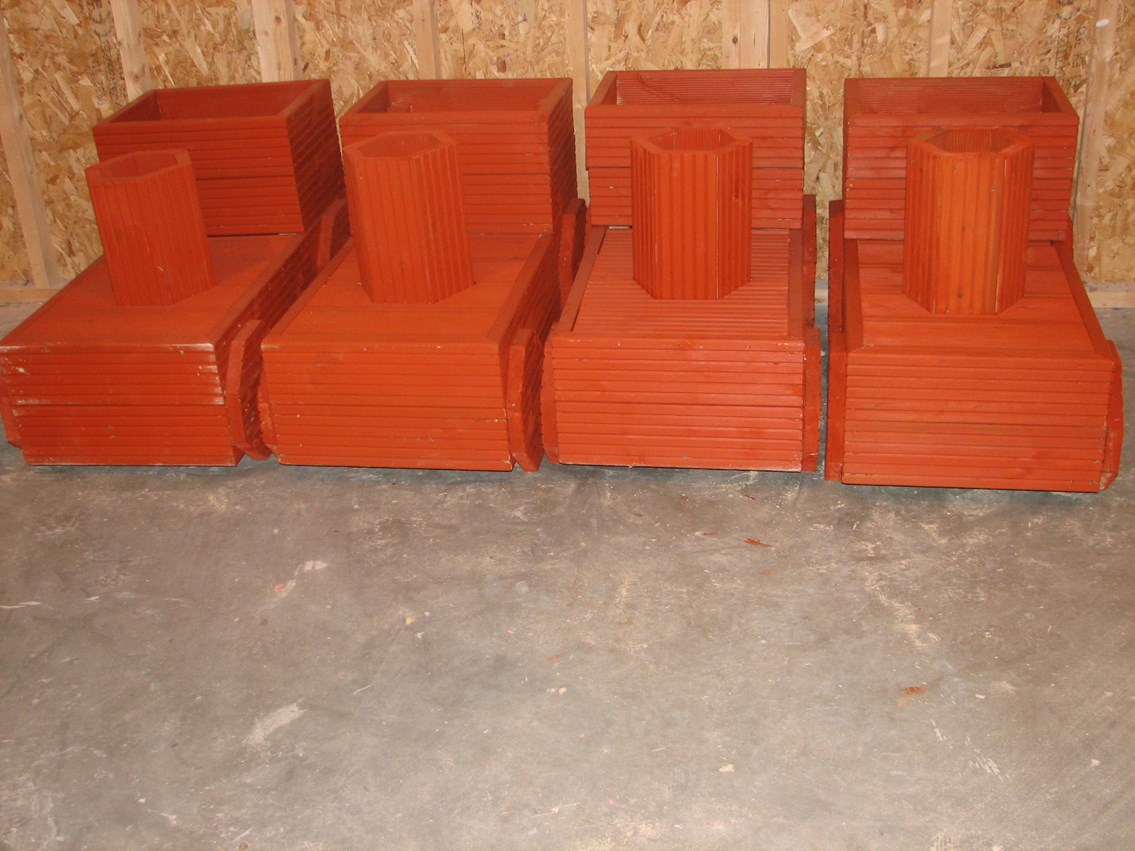 Blackrod station planters: Completed planters painted with a terracotta colour wood preservative at the POWERWAVE Skills Centre in Rivington. (Nov 2012)