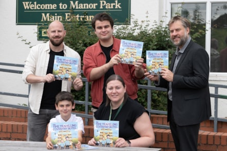 Picture is taken outside Manor Park School's main entrance and features people from left to right: 
Aaron Ashmore, Author
Oscar Ashmore, Author
Henry Haigh, Illustrator
Mrs Swindell, Headteacher, Manor Park
John Martin, E.ON UK