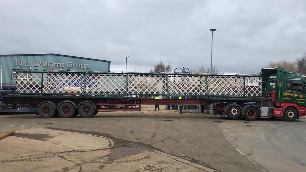 Repainted span of Harrington station footbridge on back of lorry